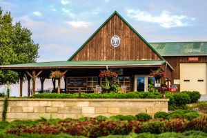 exterior of Showalter's Orchard building sunny day greenery