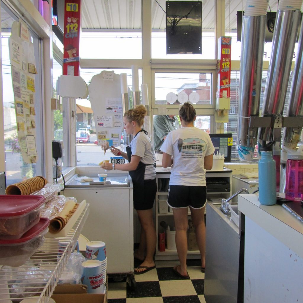 Ice cream shop employees at work