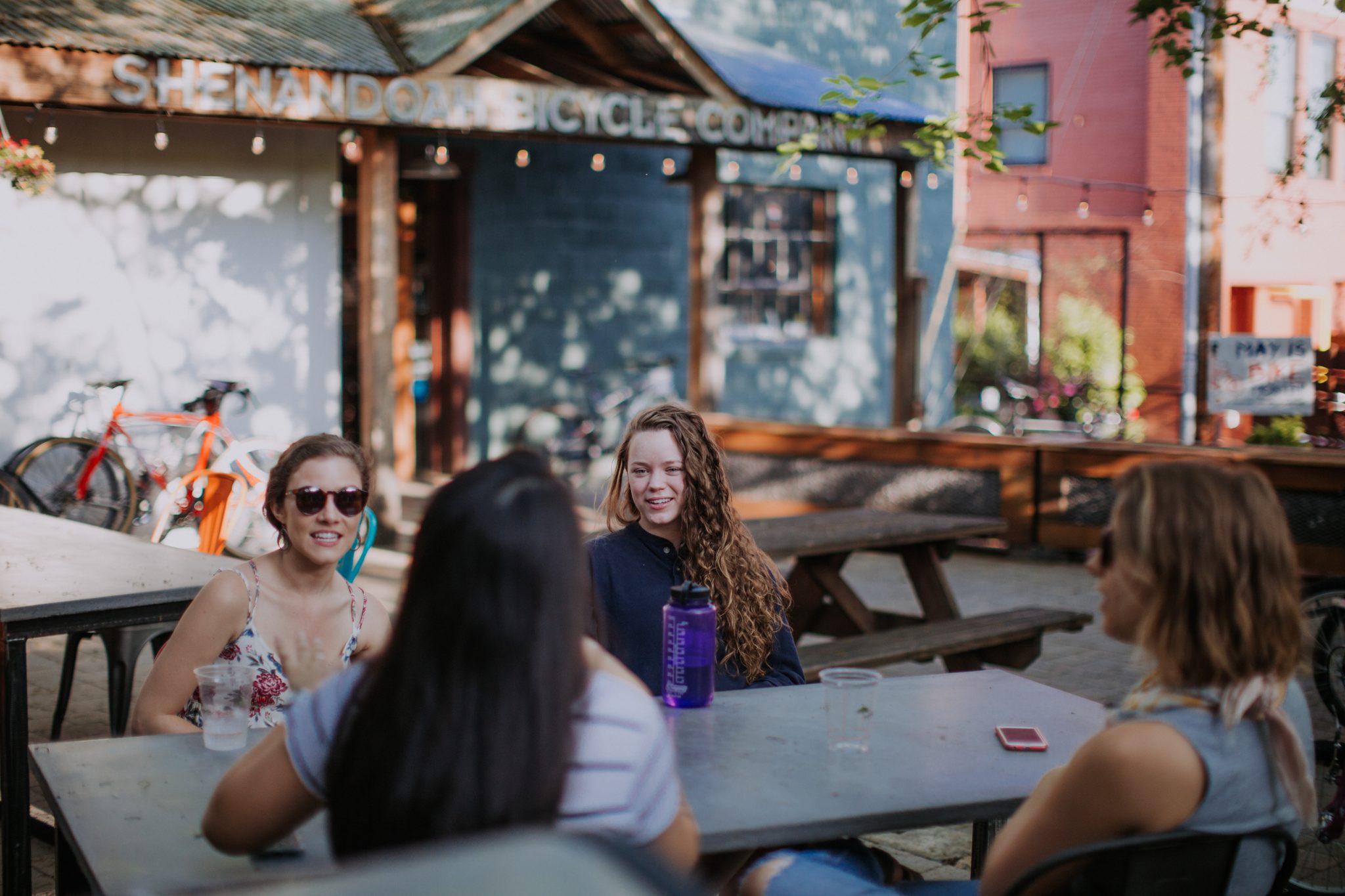 People chatting outside downtown Harrisonburg