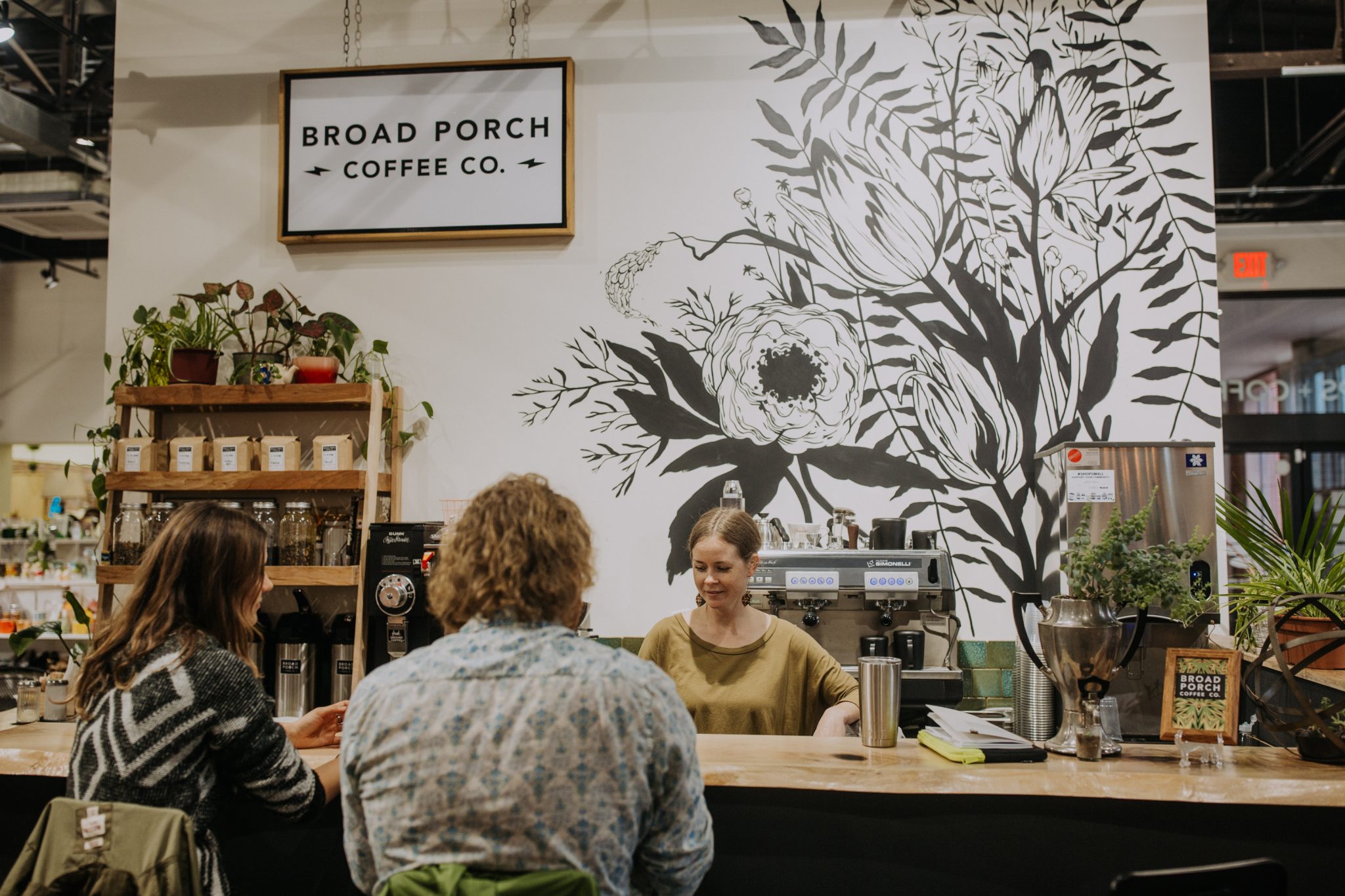 Local coffee shop happy customers many plants