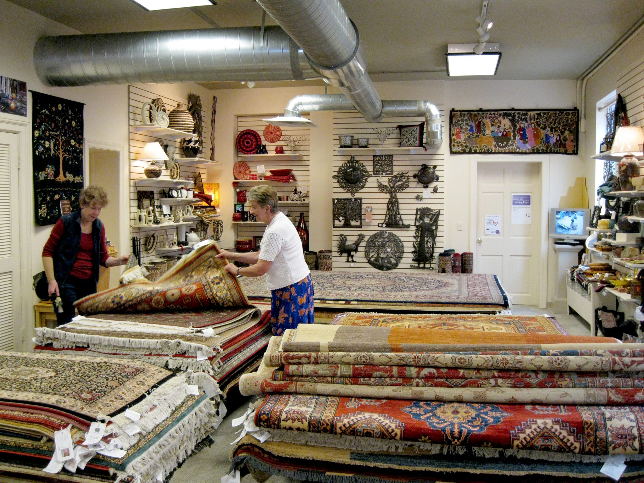 Happy women shopping for rugs and home decor