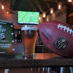 football and beer at restaurant bar super bowl sunday