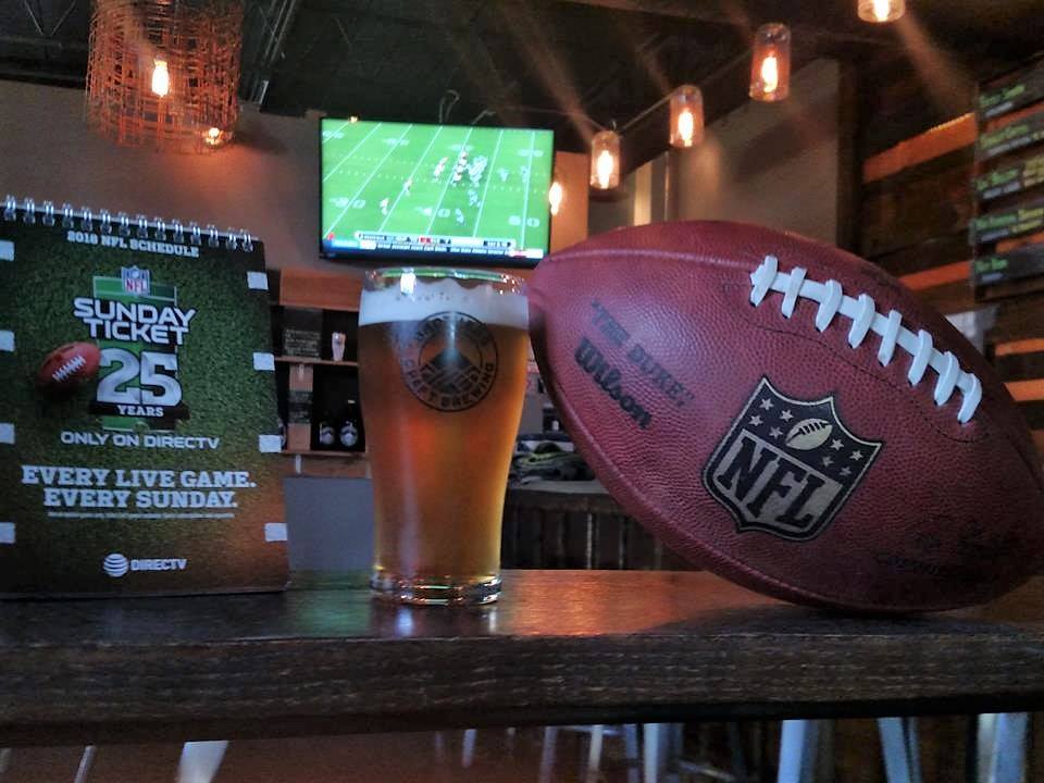 football and beer at restaurant bar super bowl sunday