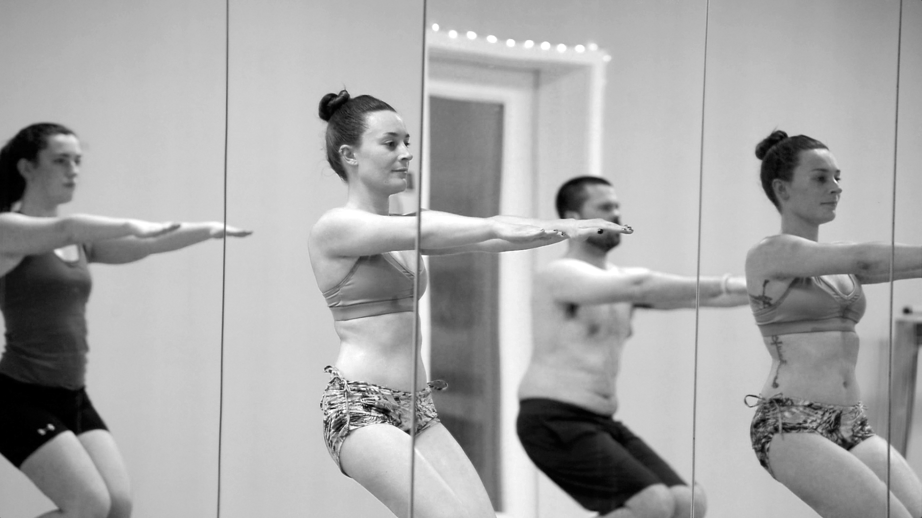 black and white photo of hot yoga class