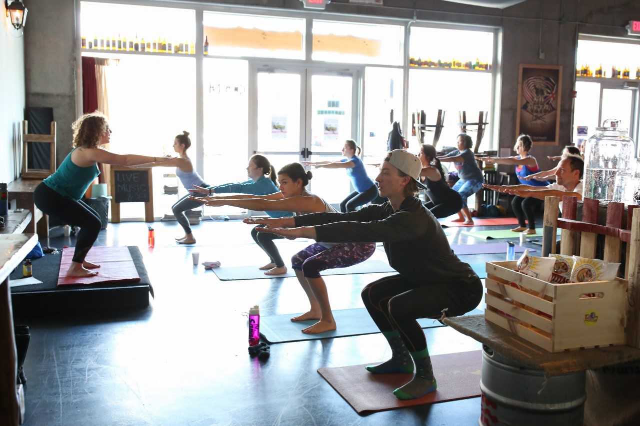 women taking a workout class at a yoga studio