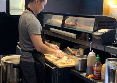 Man making sushi at Chinese restaurant