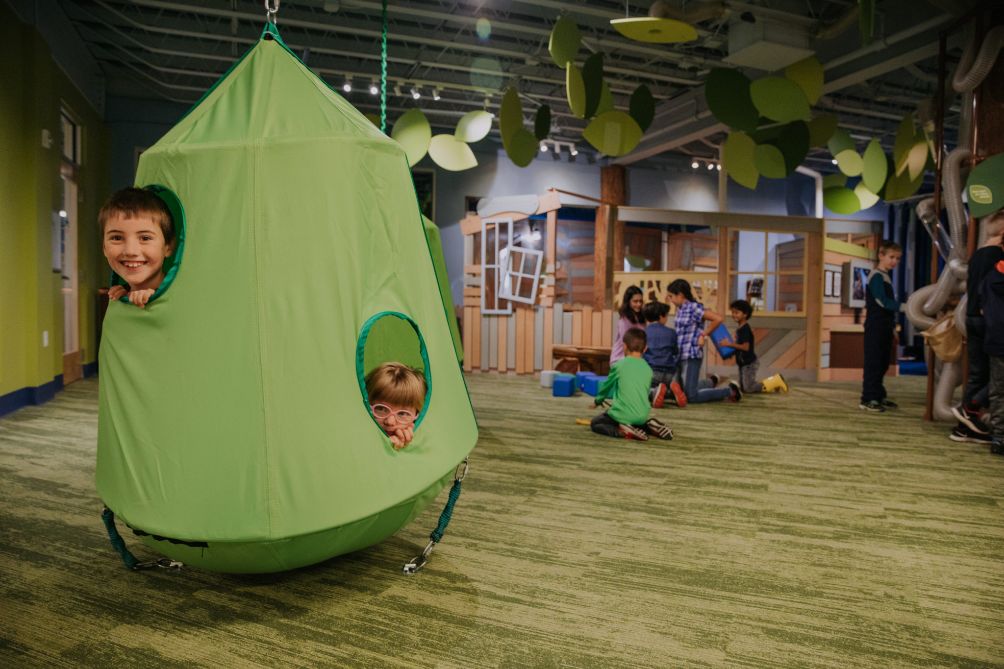 Happy children playing and exploring at children's museum