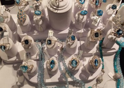 Blue jeweled rings on display