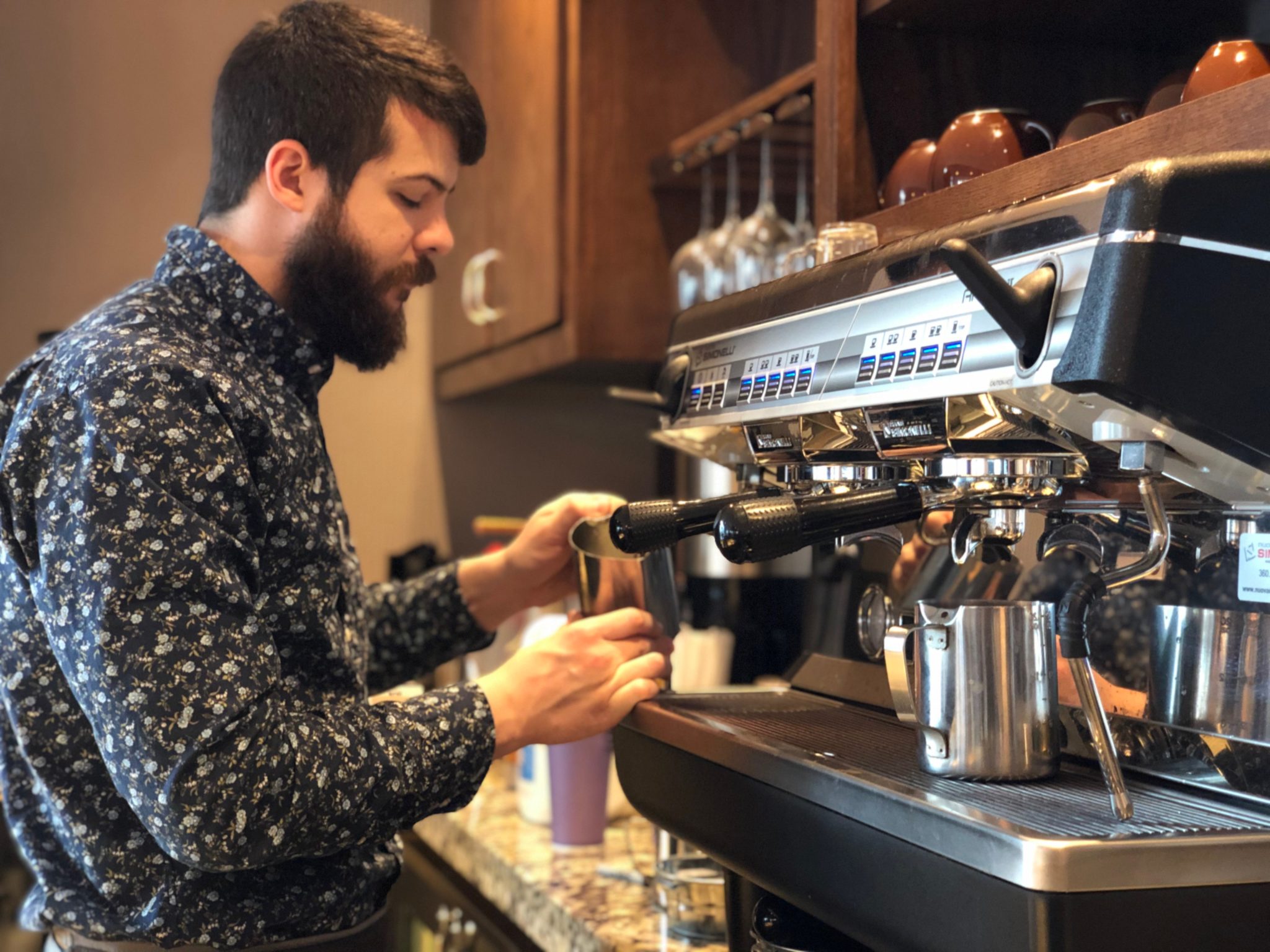 Man brewing coffee at local coffee shop Harrisonburg Virginia