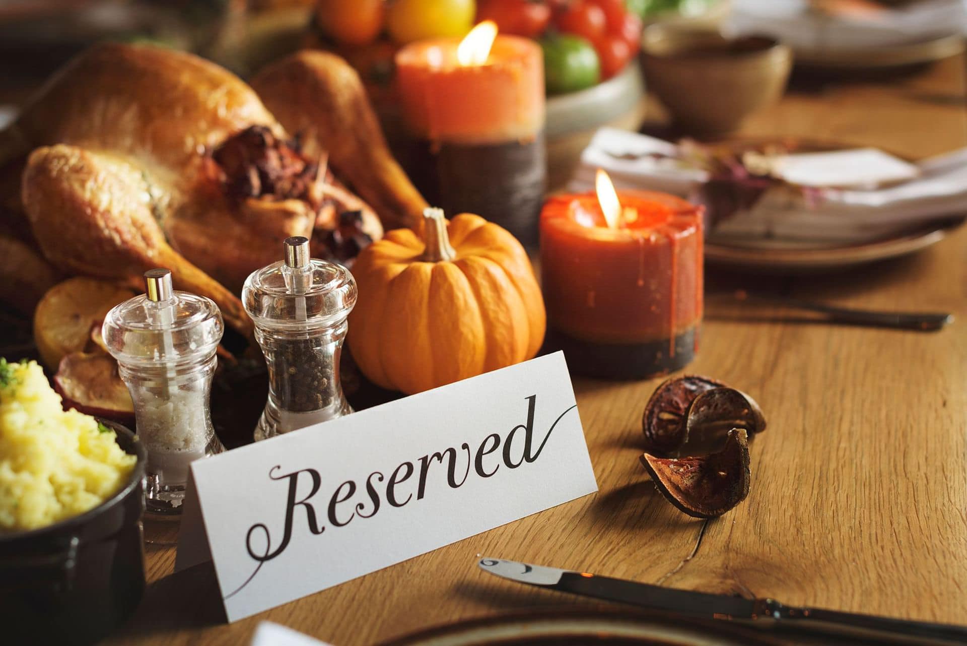 table of food with a reserved sign